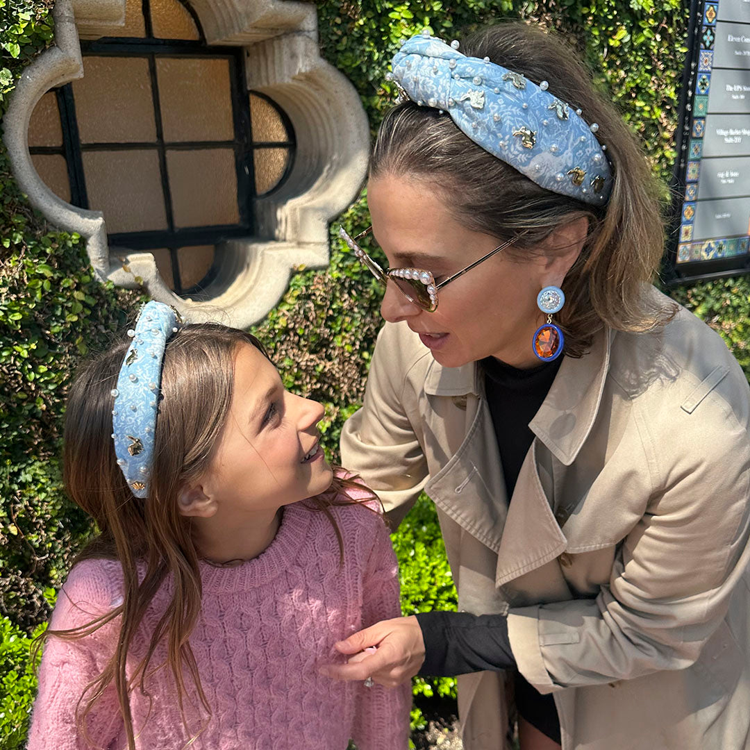 Lisa Sadoughi and her daughter wearing matching headbands