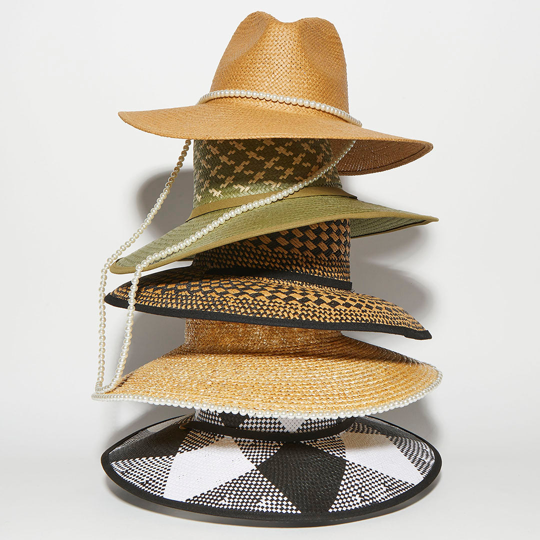 stack of Lele Sadoughi straw hats