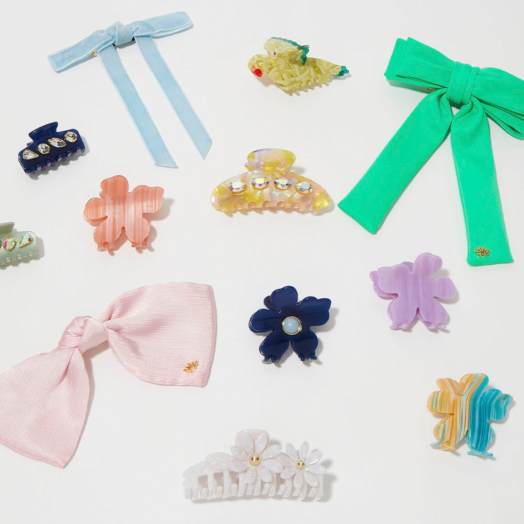 various bows and hair clips on white background