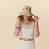 Lele Sadoughi HATS TURQUOISE LAPIS SCARAB EMBELLISHED RAFFIA BUCKET HAT